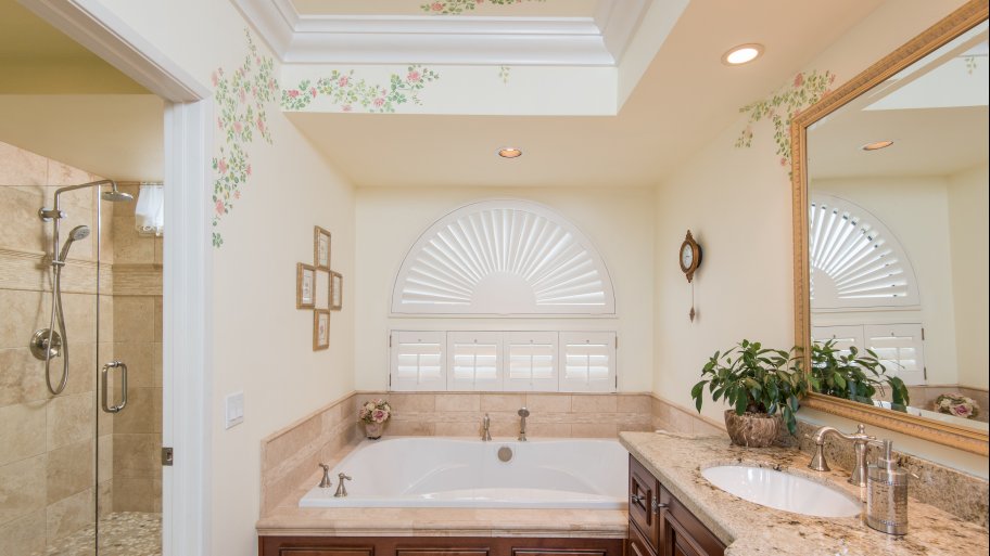 bathroom vanity in Sedona walnut with a birch granite countertop